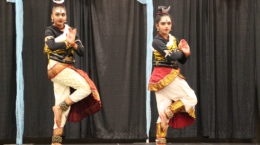 Two women culturally dancing